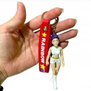 Red Keychain with White and Purple Figure